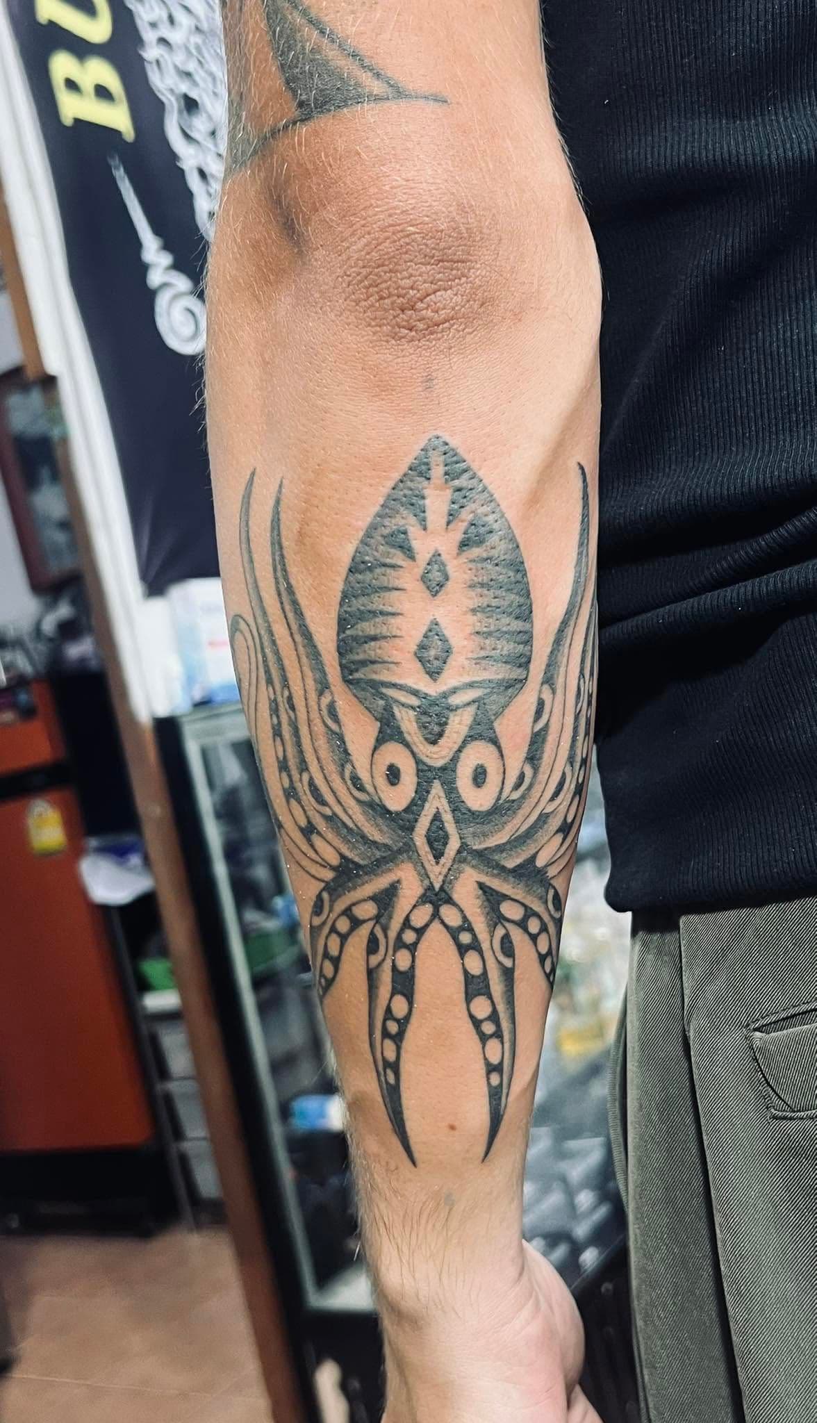 Spider yantra design on a forearm